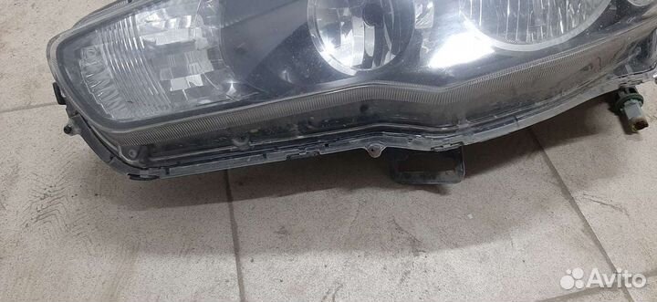 Фара Л. Mitsubishi Lancer X/2009
