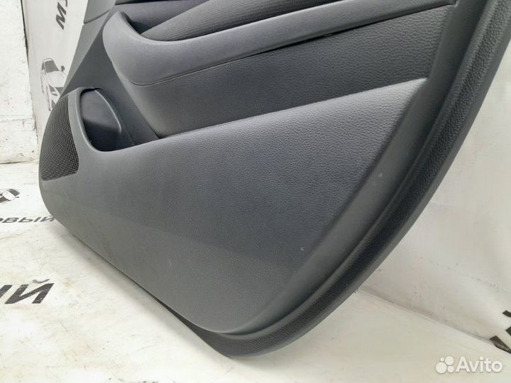 Обшивка двери передняя правая Toyota Corolla 210