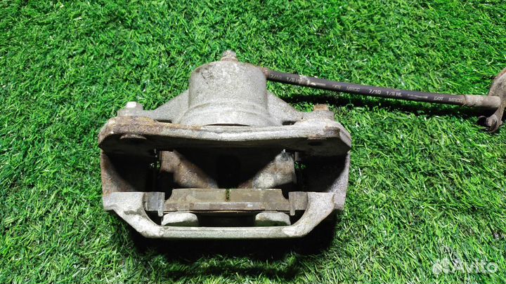 Суппорт тормозной передний левый Kia Cerato 2