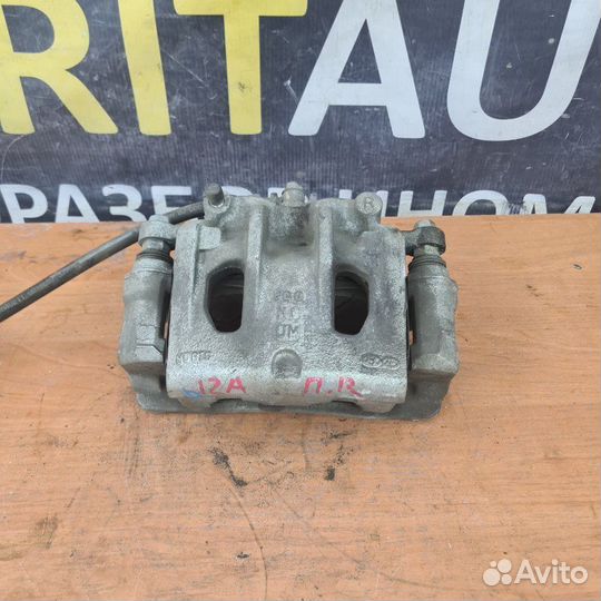 Суппорт тормозной передний правый Kia Sorento