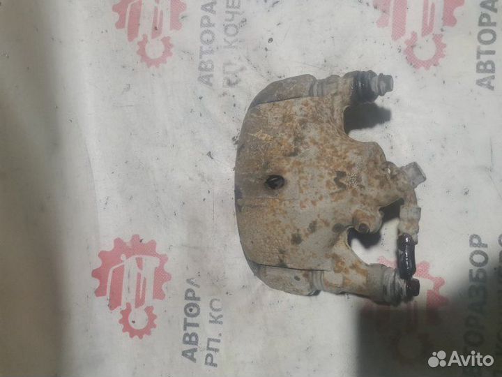 Суппорт тормозной передний левый Toyota Corolla