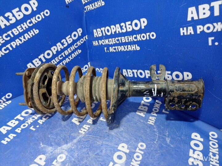 Передняя левая стойка амортизатора Mazda 626 седан