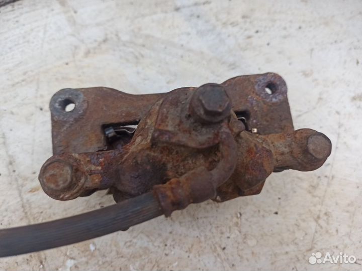 Суппорт задний левый