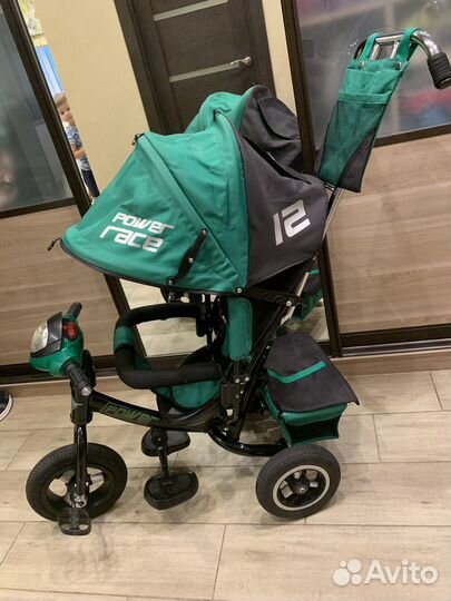 Трехколесный велосипед-коляска с ручкой