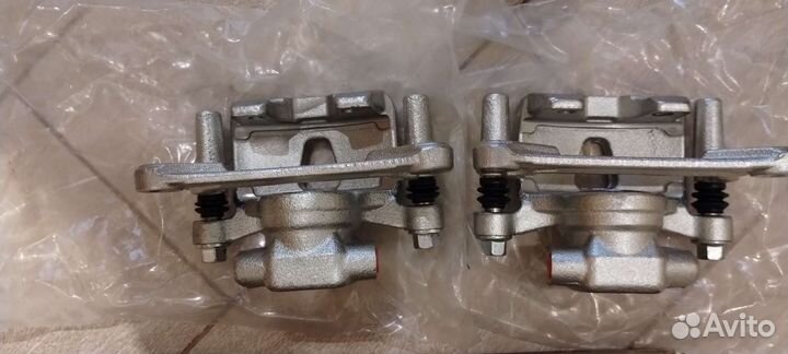 Тормозные суппорта задние, новые
