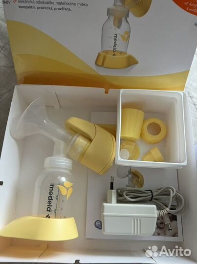 Молокоотсос medela электрический