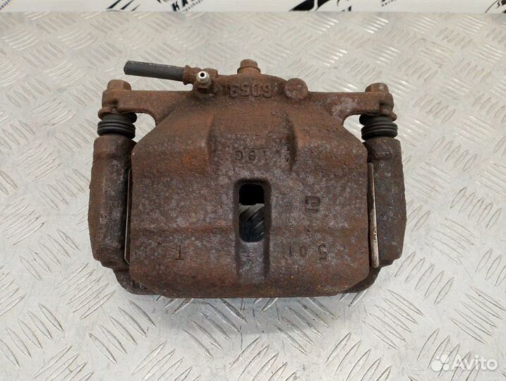 Суппорт тормозной передний левый Nissan Qashqai