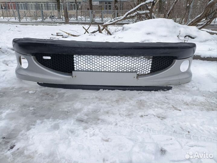 Передний бампер Peugeot 206