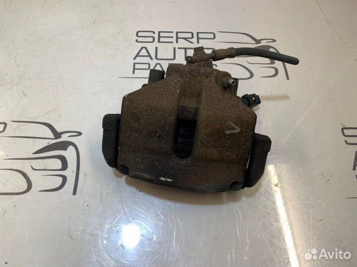 Суппорт передний левый Volkswagen Passat B6 2.0