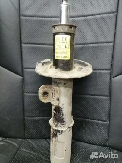 Стойка амортизатора опель антара левая