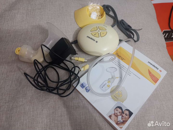 Молокоотсос Medela swing электрический