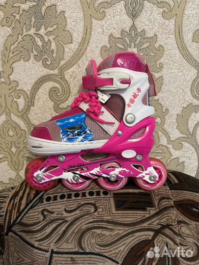 Роликовые коньки