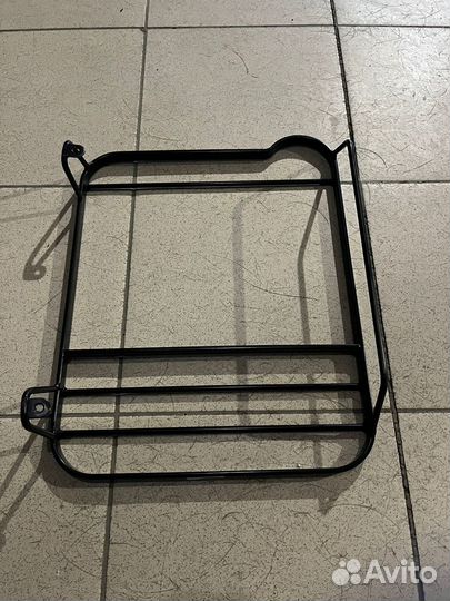 Защитная решетка задних фонарей Defender