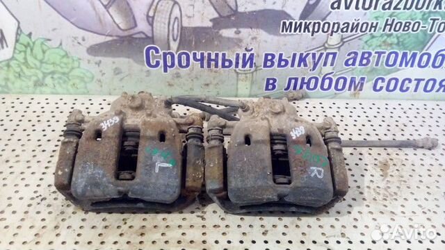 Суппорт тормозной передний Mitsubishi Colt