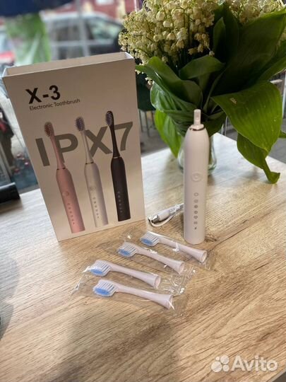 Электрическая зубная щетка