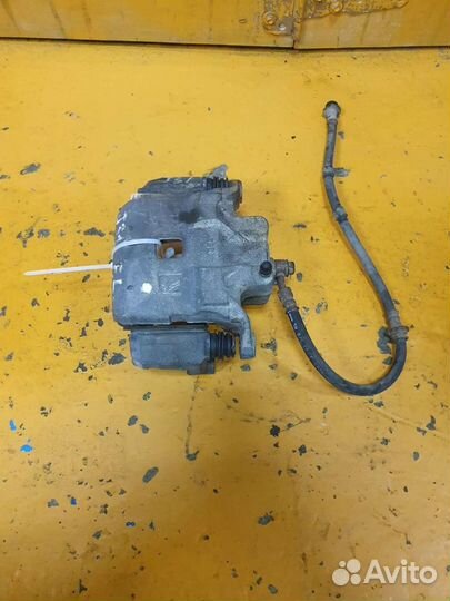 Суппорт тормозной передний левый Nissan Teana