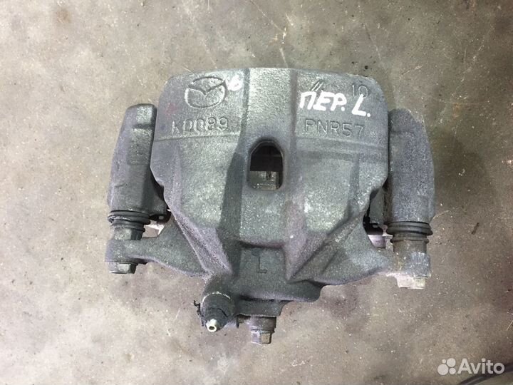 Мазда 6 Суппорт передний Лев