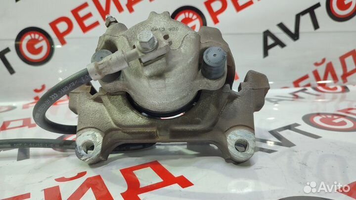 Суппорт тормозной передний левый Volkswagen Tiguan