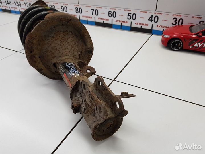 Амортизатор передний левый с пружиной (Kia Rio)