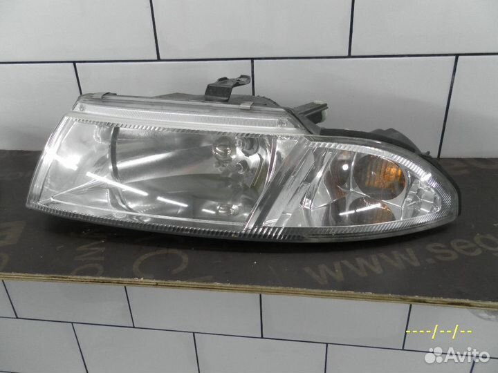 Фара передняя левая Mitsubishi Carisma