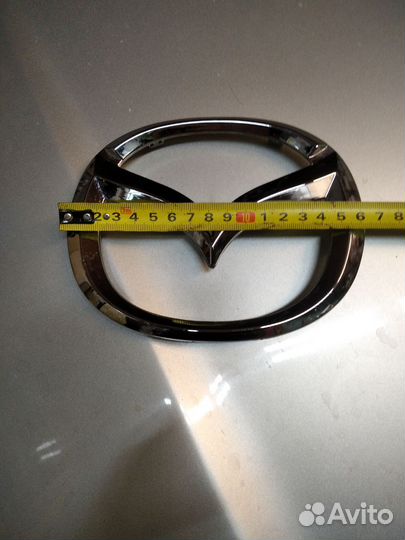 Эмблема мазда