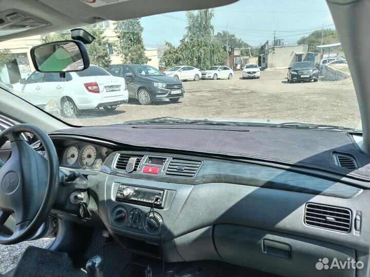 Накидка на панель mitsubishi lancer 9