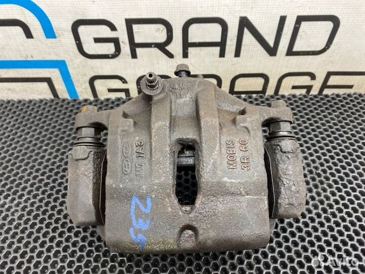 Суппорт передний левый Kia Sportage 3