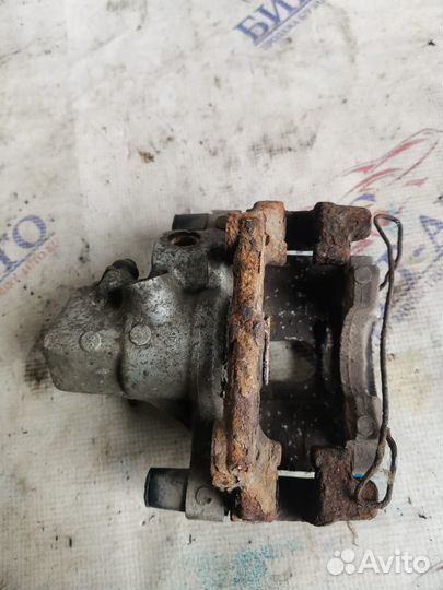 Суппорт тормозной задний левый Ford Focus II реста