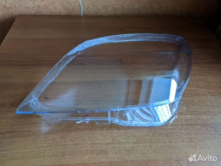 Стекло фары Opel Astra H