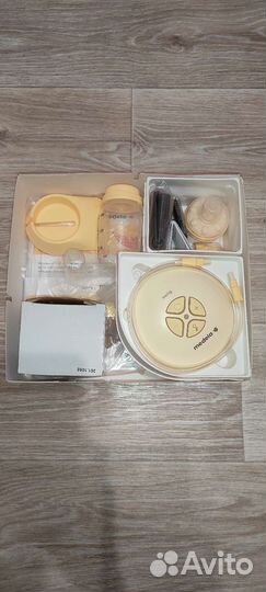 Молокоотсос medela электрический