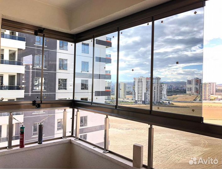 Безрамное раздвижное остекление