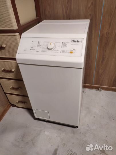 Стиральная машина с вертикальной загрузкой Miele