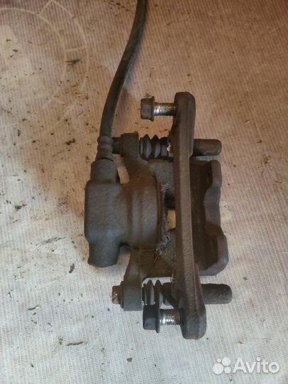 Суппорт тормозной задний левый Peugeot 4007 DW12