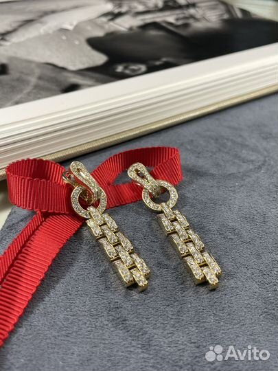 Золотые серьги cartier agrafe