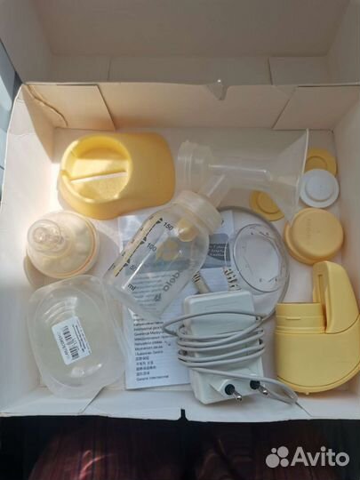 Молокоотсос medela электрический