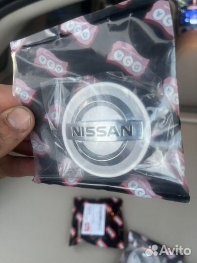 Колпачки на литые диски nissan