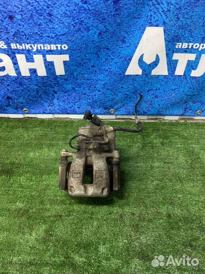 Суппорт тормозной задний левый Volkswagen Passat