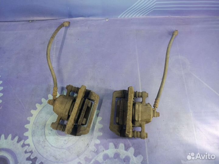 Суппорт тормозной задний Kia Sportage 2