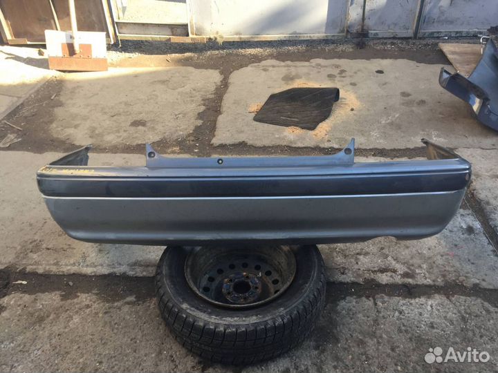 Бампер задний Toyota Carina 211