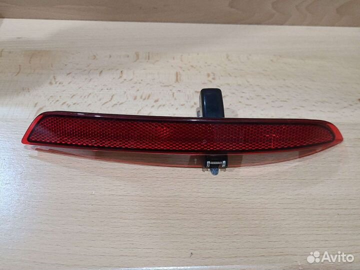 Катафот заднего бампера Opel Astra J