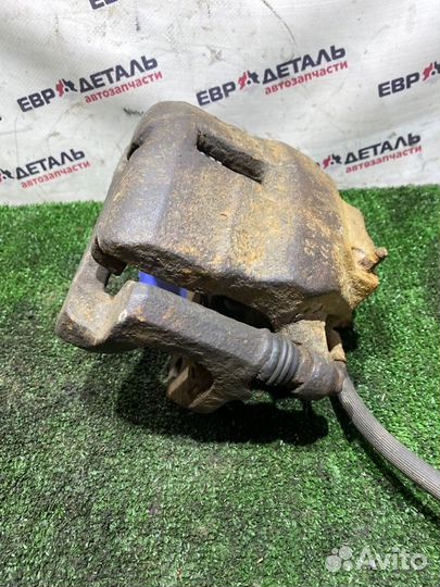 Суппорт тормозной передний левый Nissan Almera N16