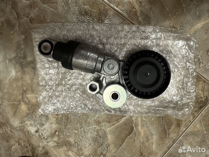 Ролик и ремень натяжителя генератора Mazda CX5