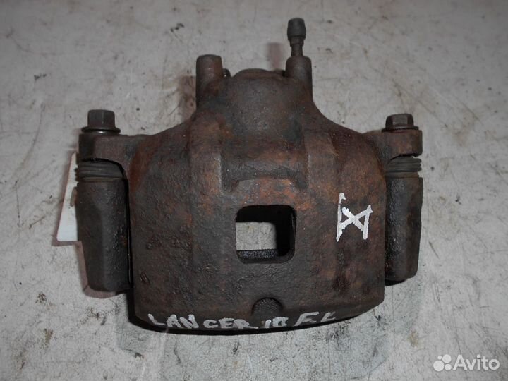 Суппорт передний левый Mitsubishi Lancer 10