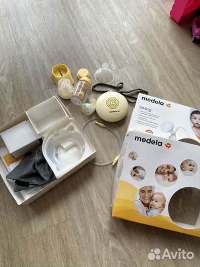 Молокоотсос medela электрический