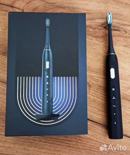 Электрическая зубная щетка