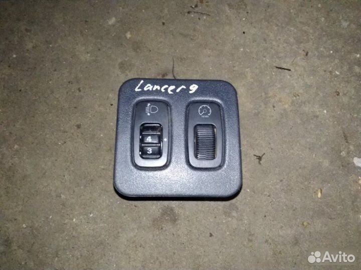Блок управления корректором фар Mitsubishi Lancer
