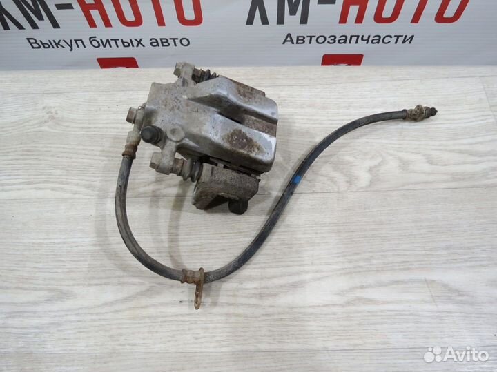 Суппорт тормозной задний левый Toyota Camry 50