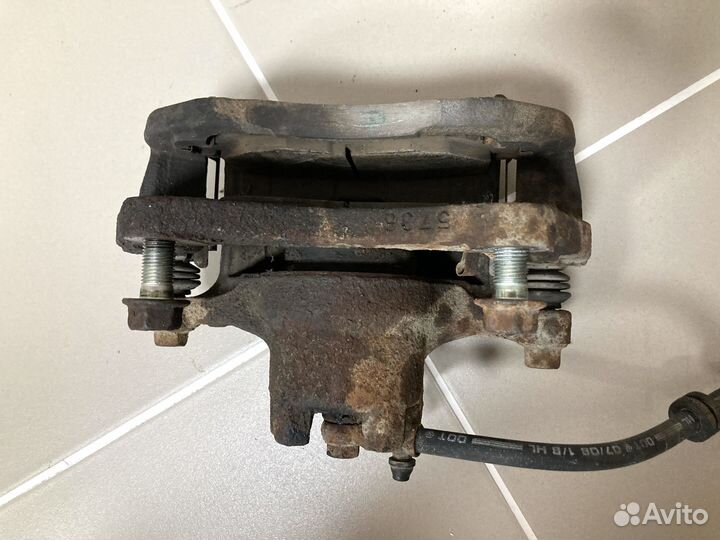 Суппорт тормозной пер левый Mitsubishi Lancer X