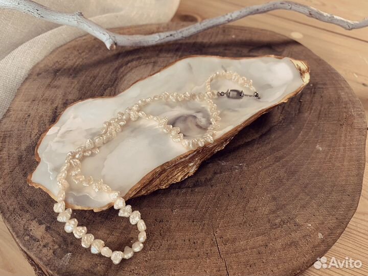 Свеча в раковине морского гребешка