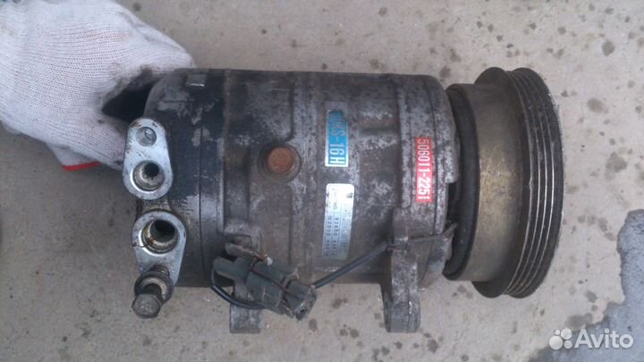 Компрессор кондиционера 92600-85E12